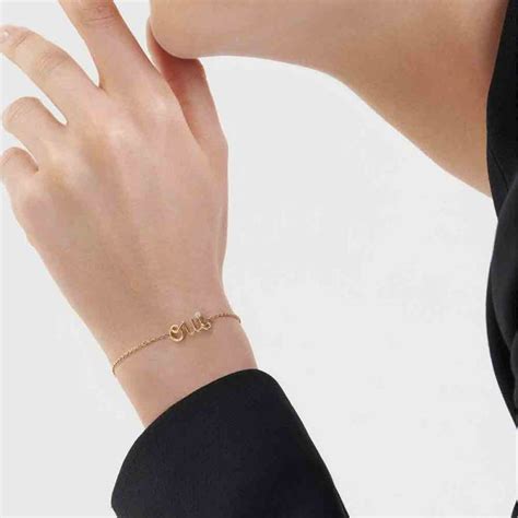 CHRISTIAN DIOR Oui Ladies Bracelet 750 Yellow Gold.